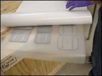 Backsheet Being Applied to Photovoltaic Module